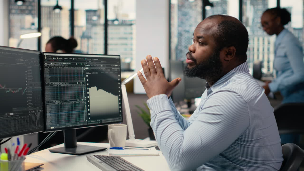 Portfolio manager in office evaluates capital allocation based on statistics