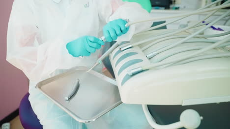 dentist working on dental equipment