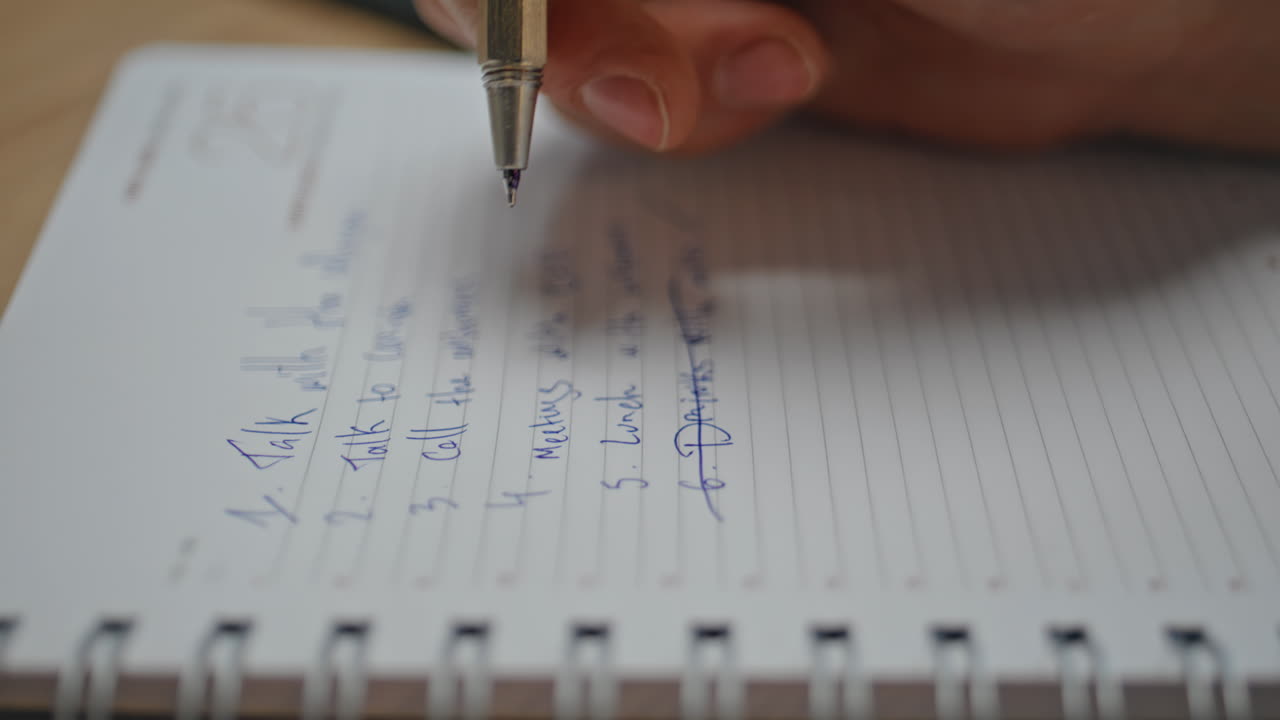 Businessman hands crossing points at desk closeup. Freelancer preparing schedule