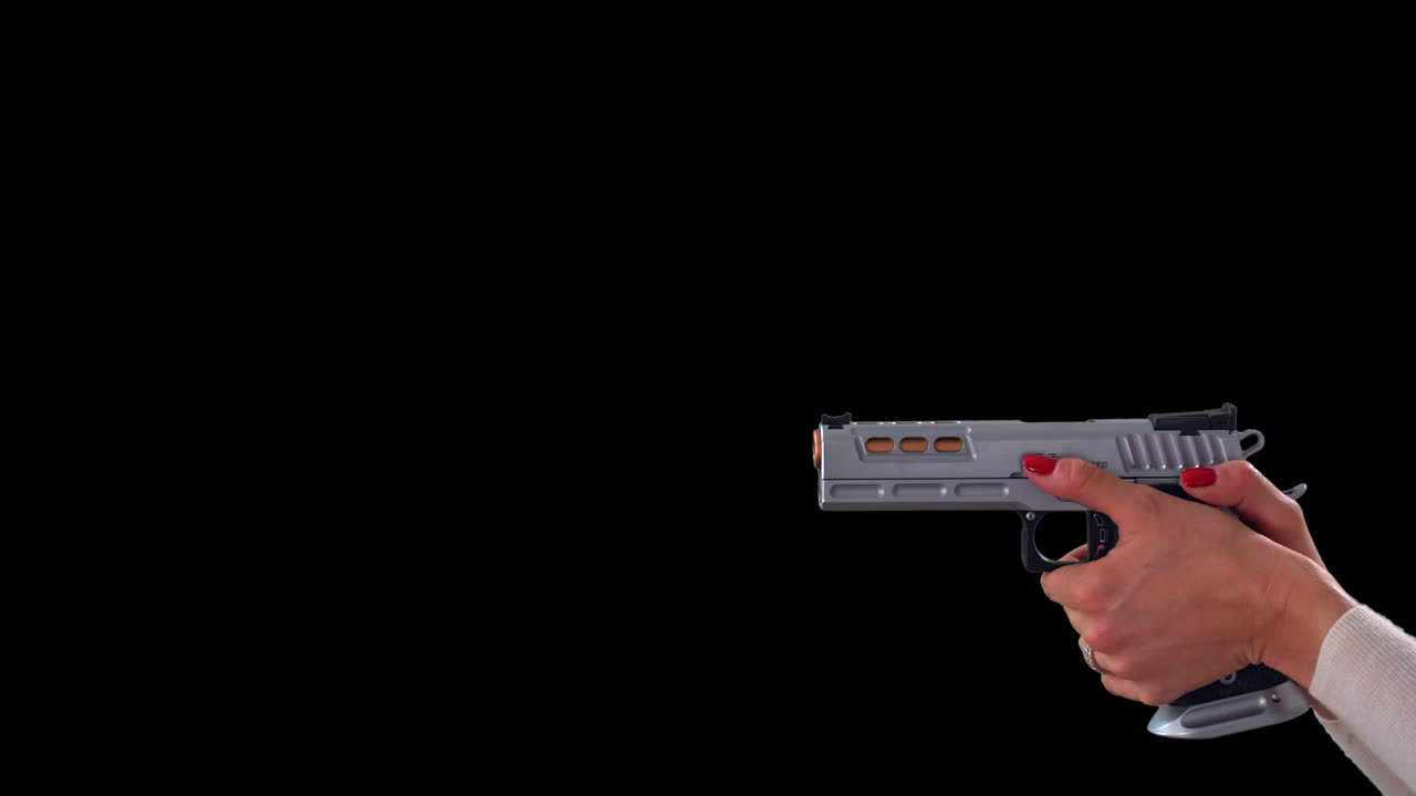 Woman aiming large silver handgun on black background