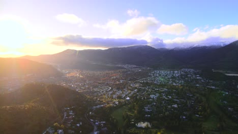 Drone-shot-flying-over-a-wealthy-suburb-of-Santiago-de-Chile-at-sunset