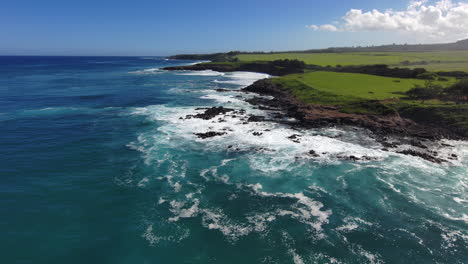 flying backwards along the north shore in maui, near the road to hana