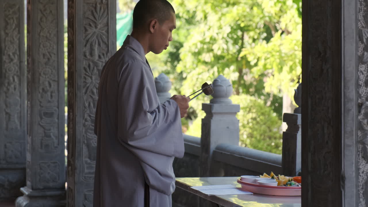 Buddhist Monk Performing a Ceremony in a Temple
