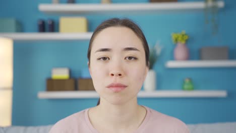 close-up of depressed asian young woman.