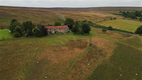 Establishing-Drone-Shot-of-Houses-and-Fields-in-North-York-Moors