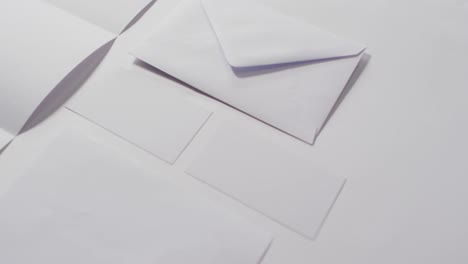 video of envelope and white cards with copy space on white background