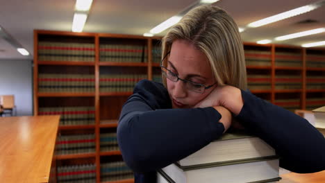 Librarian-sleeping-on-her-books