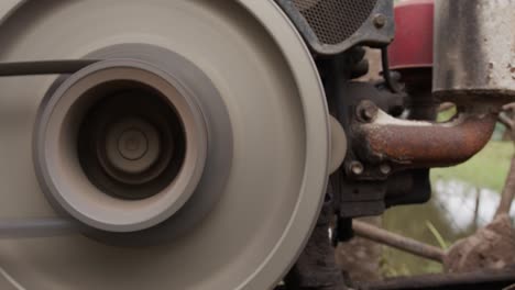 close up, belt rotation on the tractor engine.