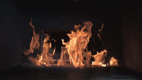 a fire burning in a stone furnace filmed