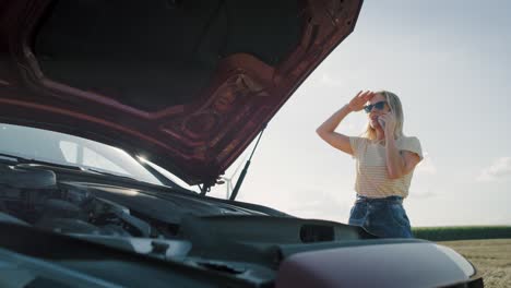 Handheld-video-of-helpless-woman-calling-roadside-assistance