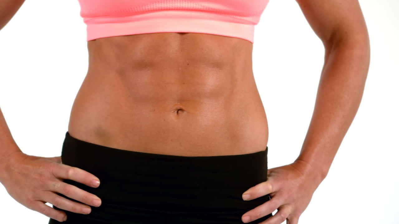 Mid section of fit woman