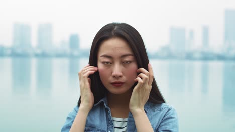 handheld video shows of vietnamese young woman looking at camera