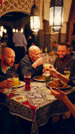 a group of people enjoying a traditional dinner in a restaurant
