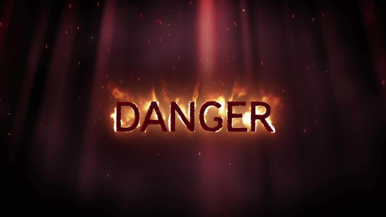 Danger in flames on black background