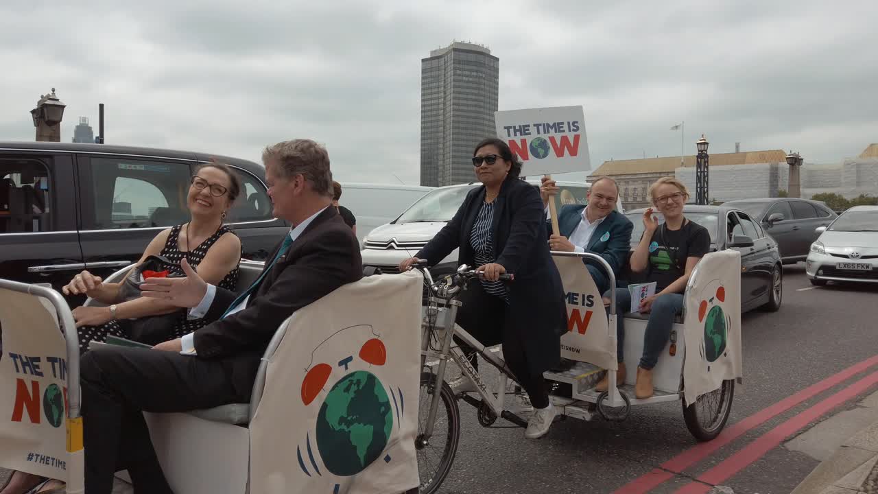 Climate change protestors lobby along the banks of the Thames and outside the houses of Parliament as part of the Time is Now protest