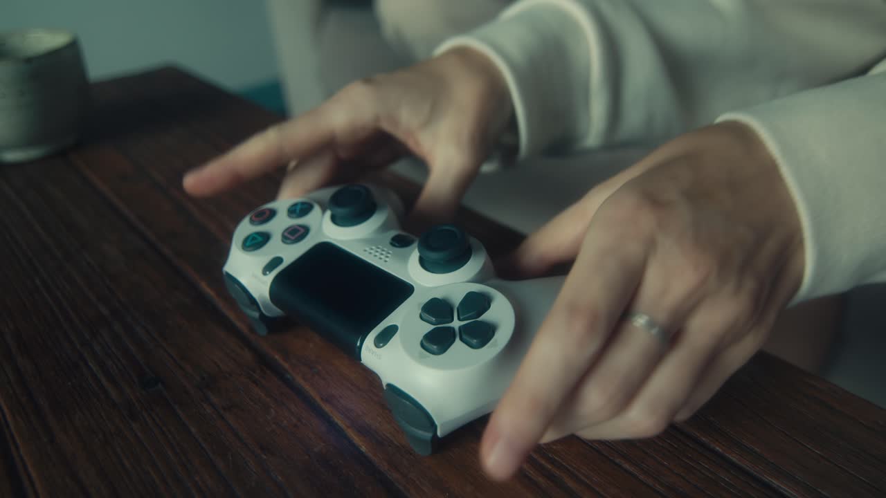 Woman playing video games at home
