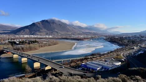 a timelapse of the overlanders bridge and the partially frozen thompson river in kamloops, british columbia