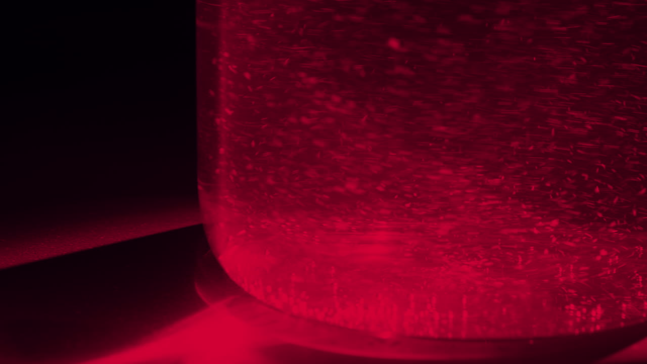 effervescent tablet melted in glass of water making tons of bubble in red light meaning of emergency for virus or disease