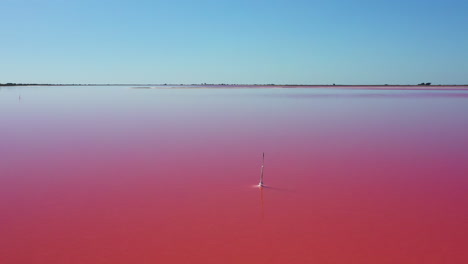 The-historical-town-of-Aigues-Mortes-in-the-Camargue,-France-during-a-sunny-summer-day-which-is-located-next-to-a-pink-salt-lake