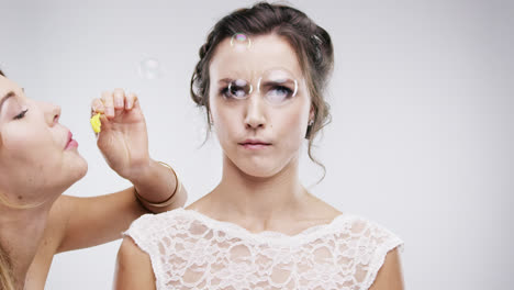 bridesmaid blowing bubbles slow motion wedding photo booth series