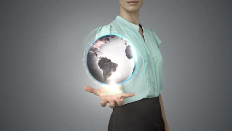 businesswoman holding digital generated globe