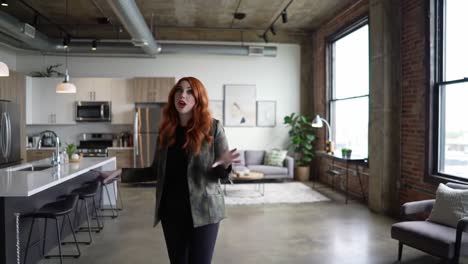 a stylish woman in a modern loft: showcasing a chic urban living space with large windows and ample natural light