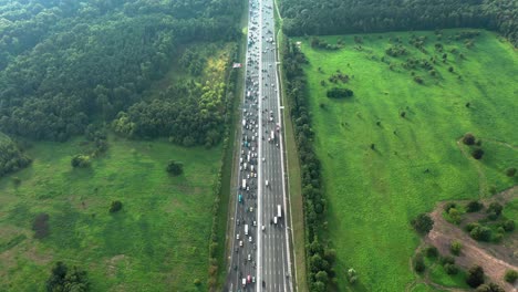 top down aerial view of highway with traffic jam at rush hour