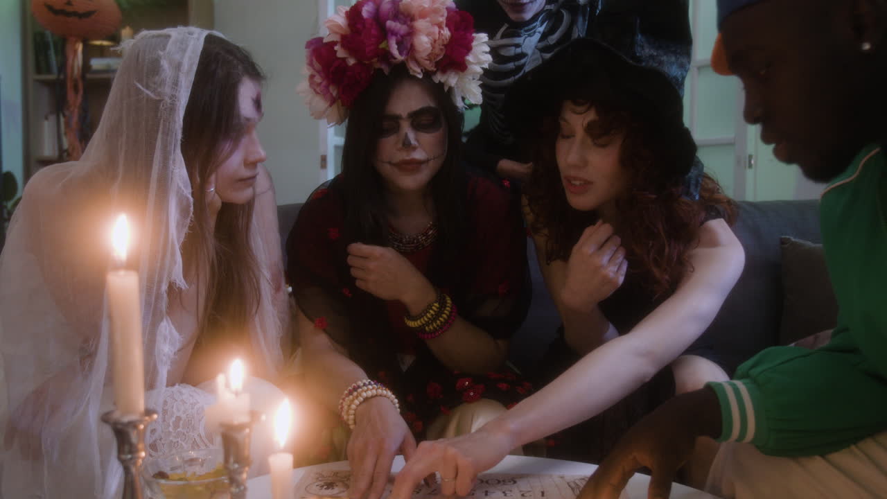Friends Celebrating Halloween with Ouija Board