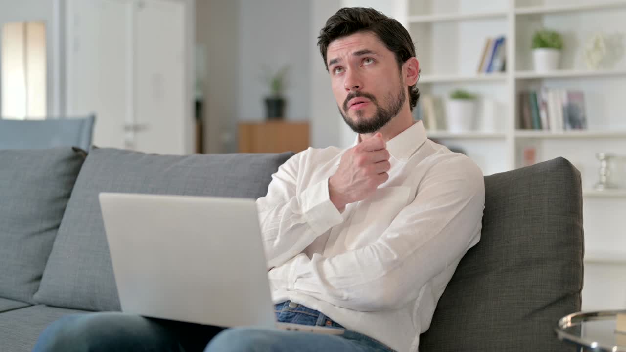 Professional Businessman Thinking and Working on Laptop at Home