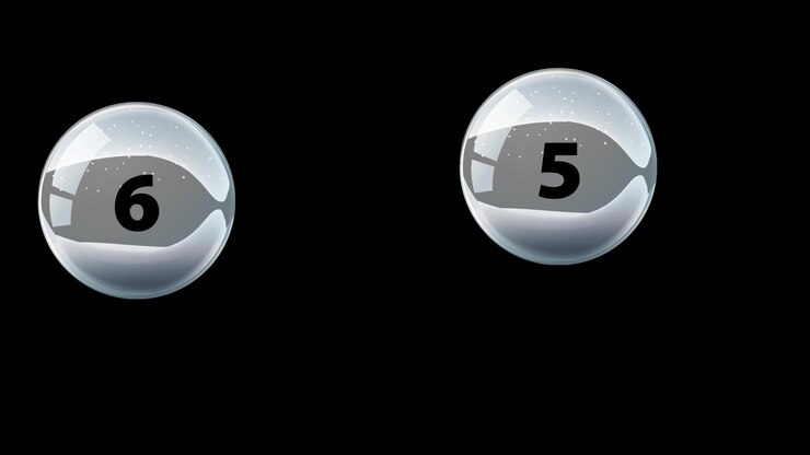 Numbered glossy spheres bounce across a black background with smooth motion and reflective highlights.