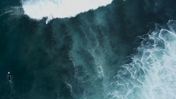 Birds Eye POV over waves and surfer, Cronulla Point, NSW