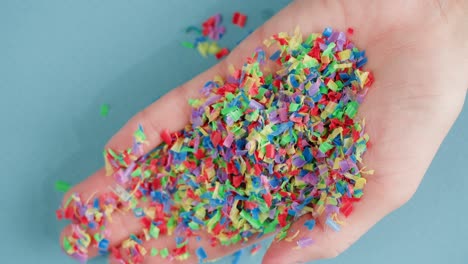 recycled plastic confetti in hand