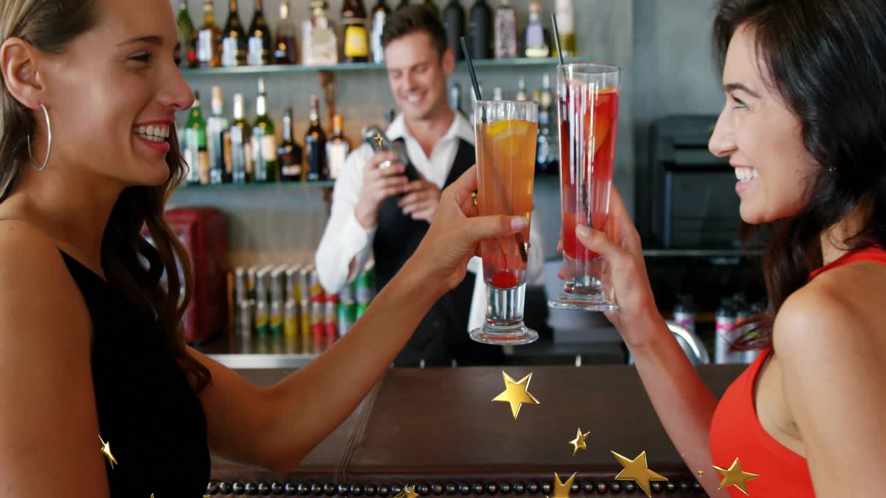 Women toasting cocktails after bartender mixing, spawning golden stars for hospitality celebration