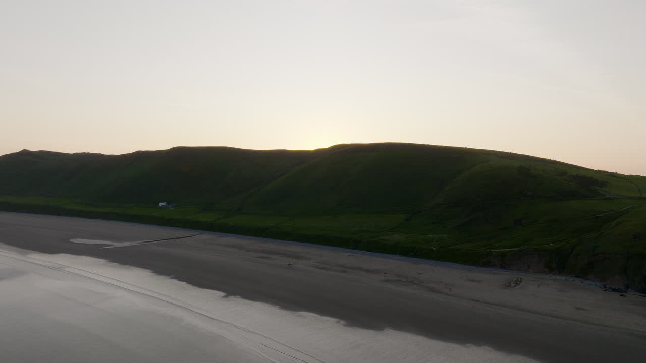 Sunset over Welsh Coastline with Beach