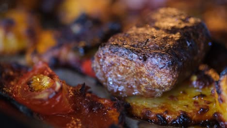 close up footage of cooking meatballs in the oven.