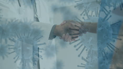 células de covid-19 moviéndose contra la sección media médico y enfermera estrechándose la mano