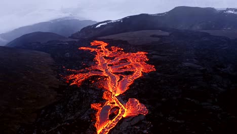 Aerial-cinematic-shots-from-a-4K-drone-provide-a-bird's-eye-view-of-cascading-lava-in-Iceland