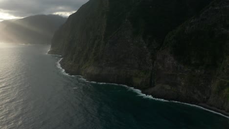 Dramatic-scenery-at-rugged-coast-of-Madeira-island-with-light-rays-from-sunrise