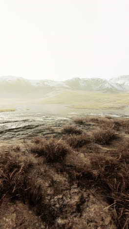 misty mountain landscape with snowy peaks