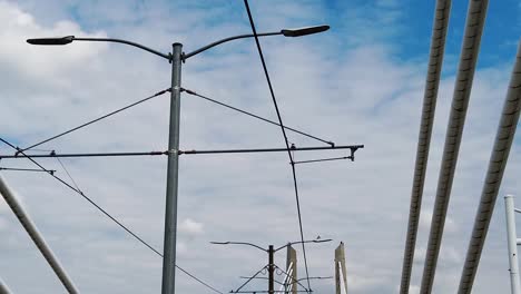 hd looking up going across tilikum crossing bridge in portland oregon with mostly cloudy sky take five