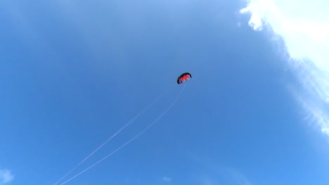 power kite flying across a blue summer sky