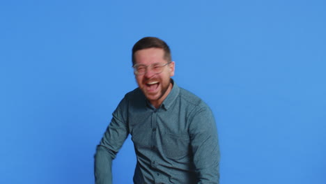 amused smiling cheerful mature man laughing out loud funny ridiculous joke anecdote bullying abuse