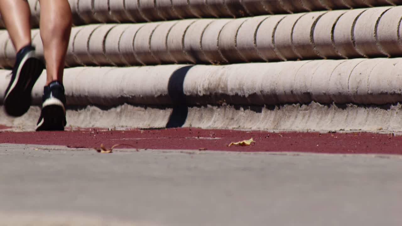 Close-up of Runner's Legs and Feet Jogging Outdoors