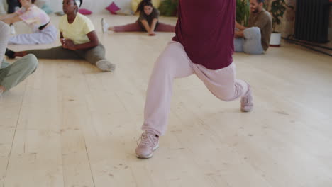 female dancer stretching in studio