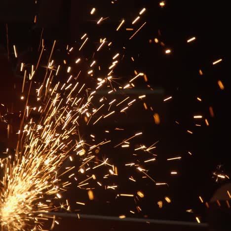 cutting steel with angle grinder in workshop
