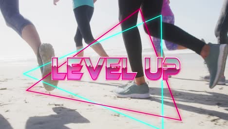 Animation-of-text-level-up,-in-metallic-pink,-with-legs-of-women-running-on-beach