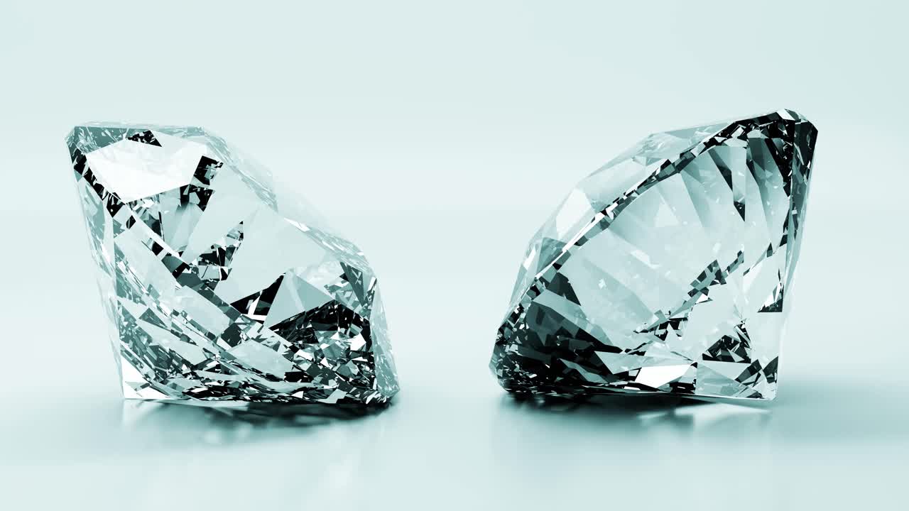 Due diamanti scintillanti su una superficie riflettente