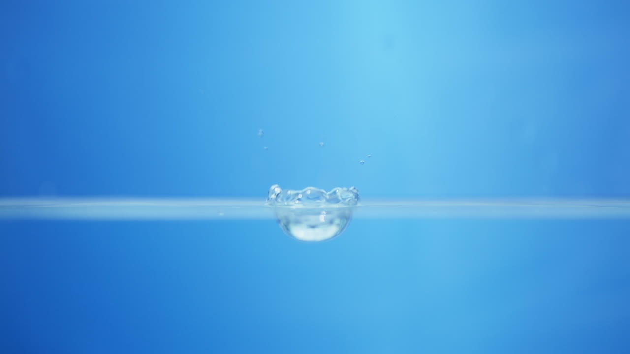 Intriguing slow-motion imagery of blue waves, representing the essence of clean and refreshing drinking water.