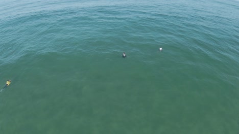 Surfers-outside,-waiting-for-the-perfect-wave-at-the-surf-championship