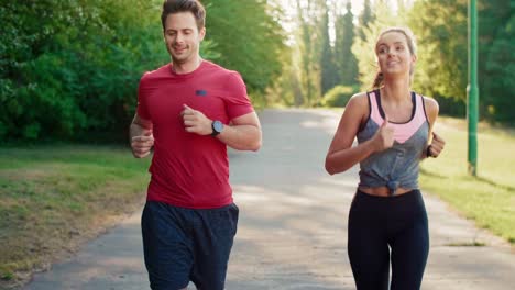 Tilt-up-of-jogging-young-couple,-Katowice,-Poland